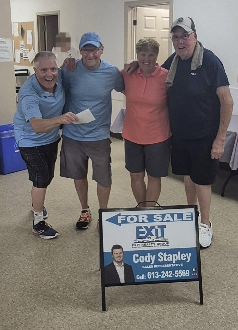 Tournament winners with Cody Stapley sign